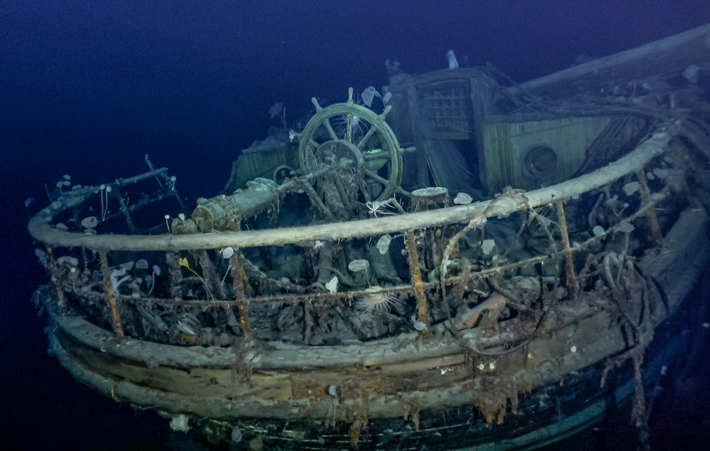 The taffrail and ship’s wheel are visible in this photograph of the wreck of legendary explorer Ernest Shackleton’s ship Endurance, which sank in November 1915 in the Weddell Sea off the coast of Antarctica. (© Falklands Maritime Heritage Trust)