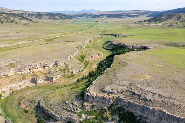 In a ravine in central Montana just north of the Little Belt Mountains lies the Painted Coulee site, where rock art depicting a warrior armed with a shield and spear thrower giving chase to an archer was recently dated to the Late Archaic period (ca. A.D. 240–425), when the bow was first being introduced to the Great Plains. (Courtesy Sacred Sites Research)